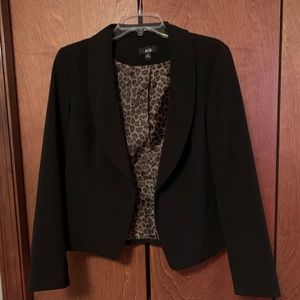 Black blazer with cheetah print inside